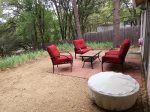 Back patio with furniture and fire pit
